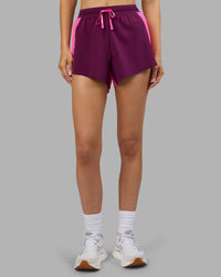 Woman wearing Accelerate 3" High-Rise Running Short - Ultra Pink-Plum Caspia | Set:true | Angle:front | Model:Leilani | Size:XS | Thumbnail Index: 5