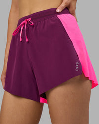 Woman wearing Accelerate 3" High-Rise Running Short - Ultra Pink-Plum Caspia | Set:true | Angle:closeup | Model:Leilani | Size:XS | Thumbnail Index: 2