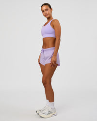 Woman wearing Accelerate Split Strap Sports Bra - Pale Lilac | Model:Brylee | Size:XS | Thumbnail Index: 6