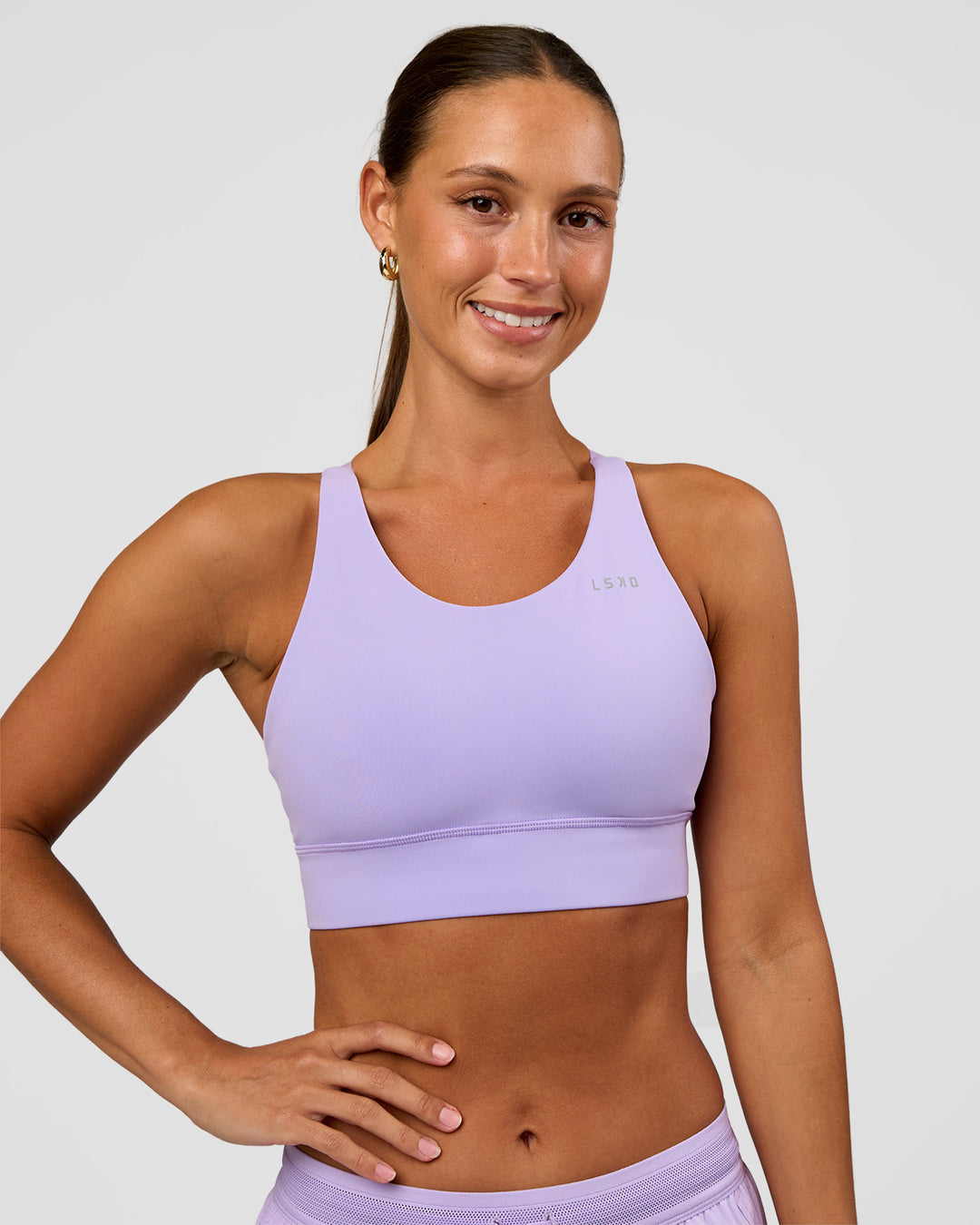 Woman wearing Accelerate Split Strap Sports Bra - Pale Lilac | Model:Brylee | Size:XS - view 2