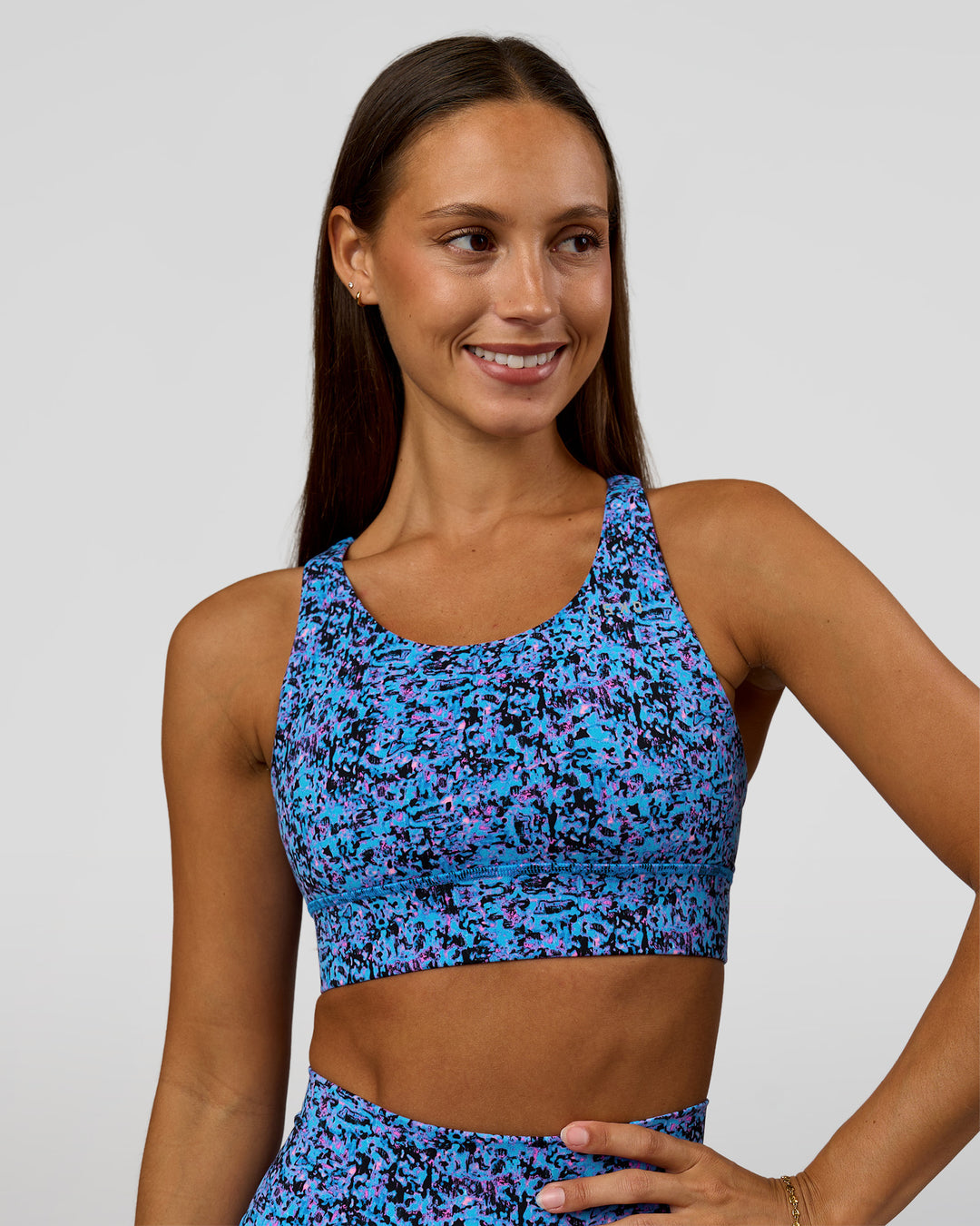 Woman wearing Accelerate Sports Bra in Energy Print Blue Multi | Model:Brylee | Size:XS - view 4
