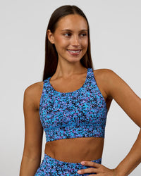 Woman wearing Accelerate Sports Bra in Energy Print Blue Multi | Model:Brylee | Size:XS | Thumbnail Index: 3
