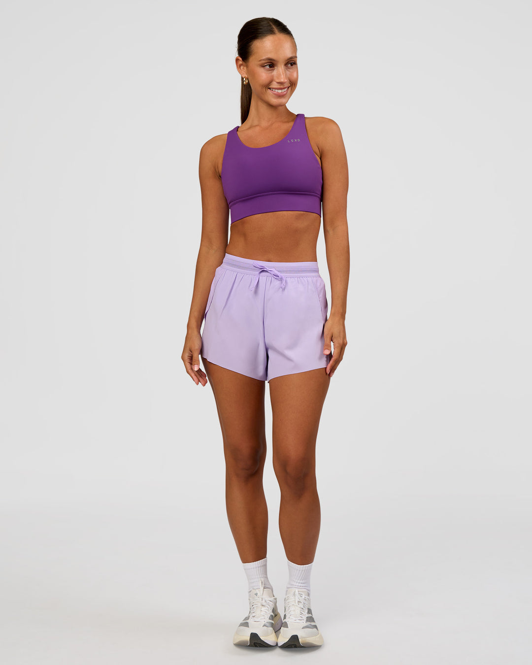 Woman wearing Accelerate Sports Bra - Fresh Purple | Model:Brylee | Size:XS - view 3