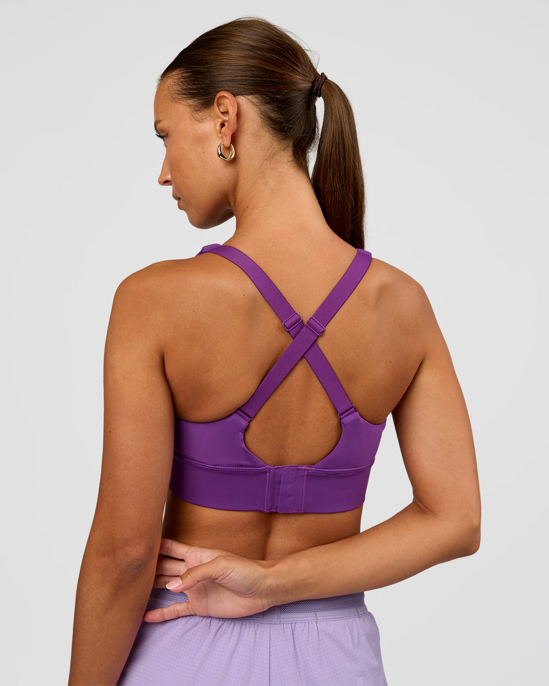 Woman wearing Accelerate Sports Bra - Fresh Purple | Set:true | Angle:back | Model:Brylee | Size:XS - view 2