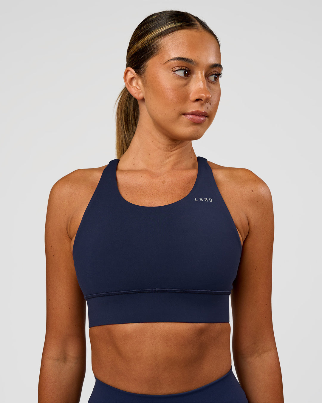 Woman wearing Accelerate Sports Bra - Future Navy | Model:Charlie | Size:XS - view 5