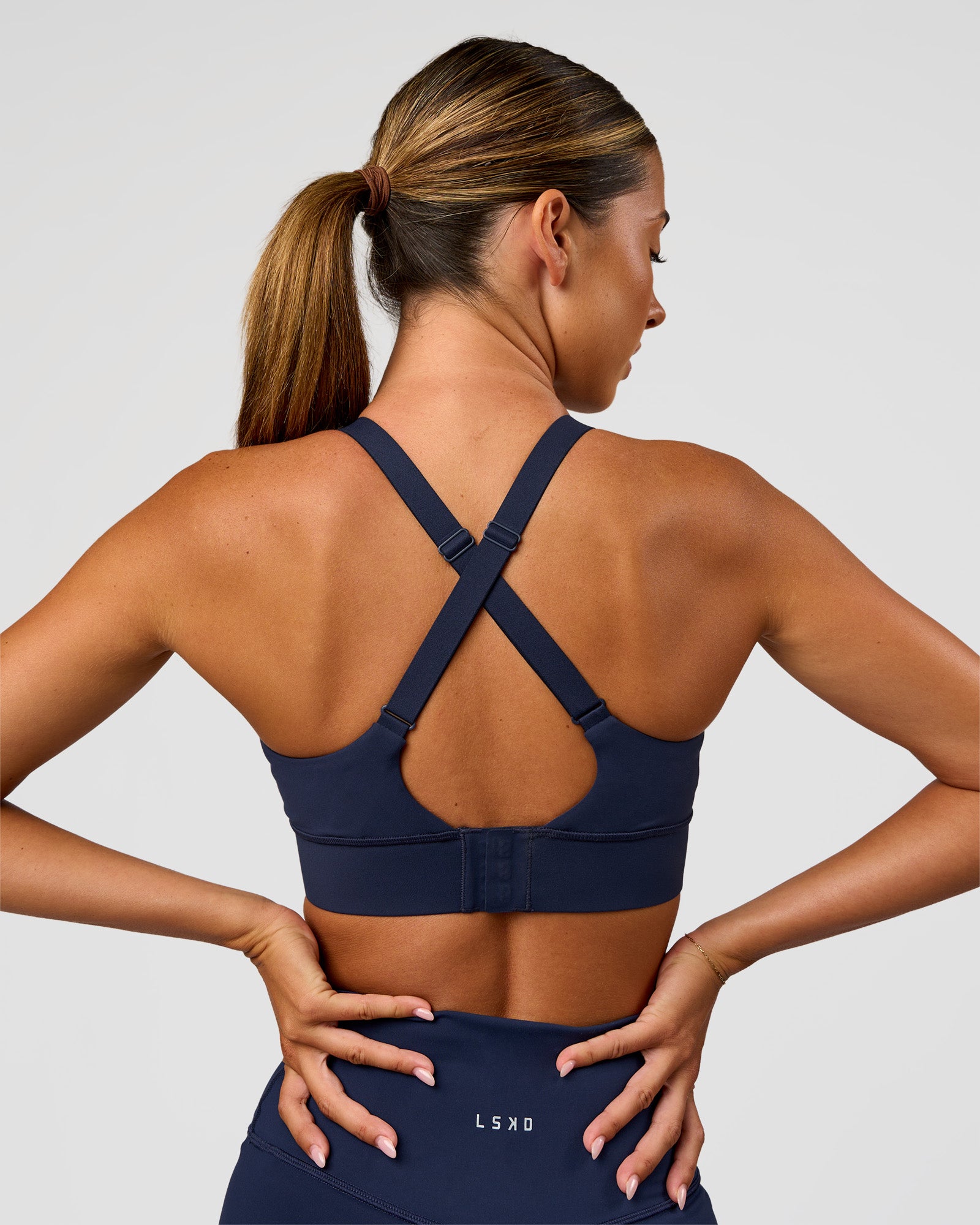 Woman wearing Accelerate Sports Bra - Future Navy | Model:Charlie | Size:XS