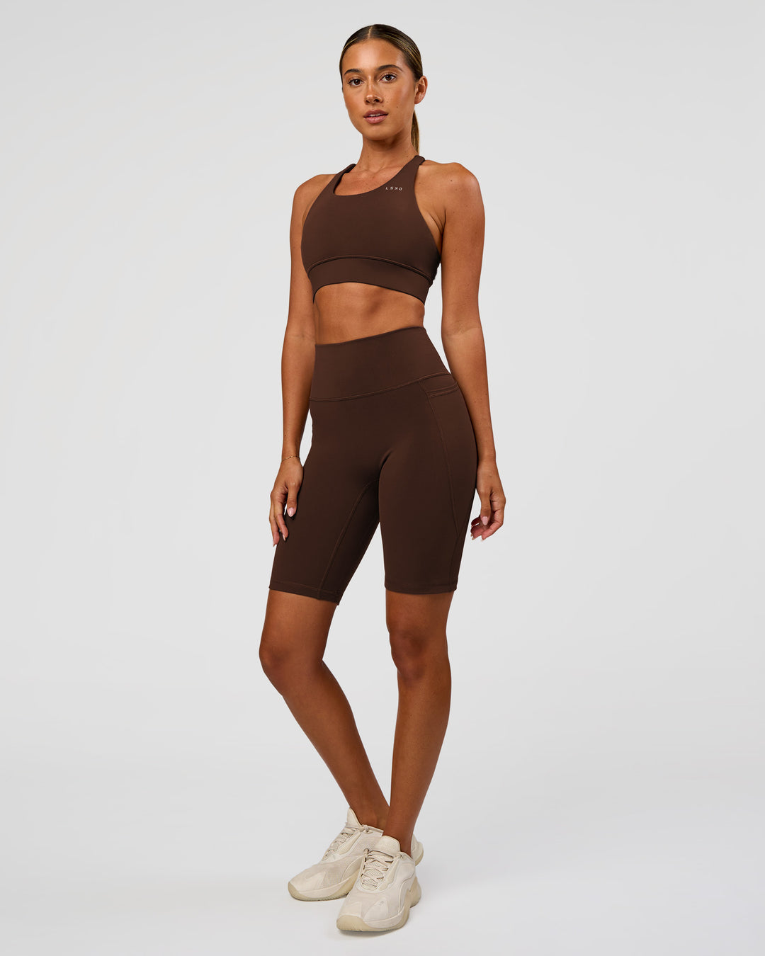 Woman wearing Accelerate Sports Bra - Hot Chocolate | Model:Charli | Size:XS - view 4