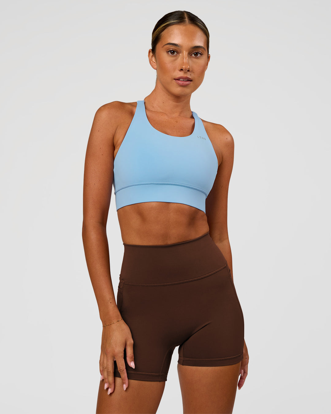 Woman wearing Accelerate Sports Bra - Open Air | Model:Charli | Size:XS - view 1