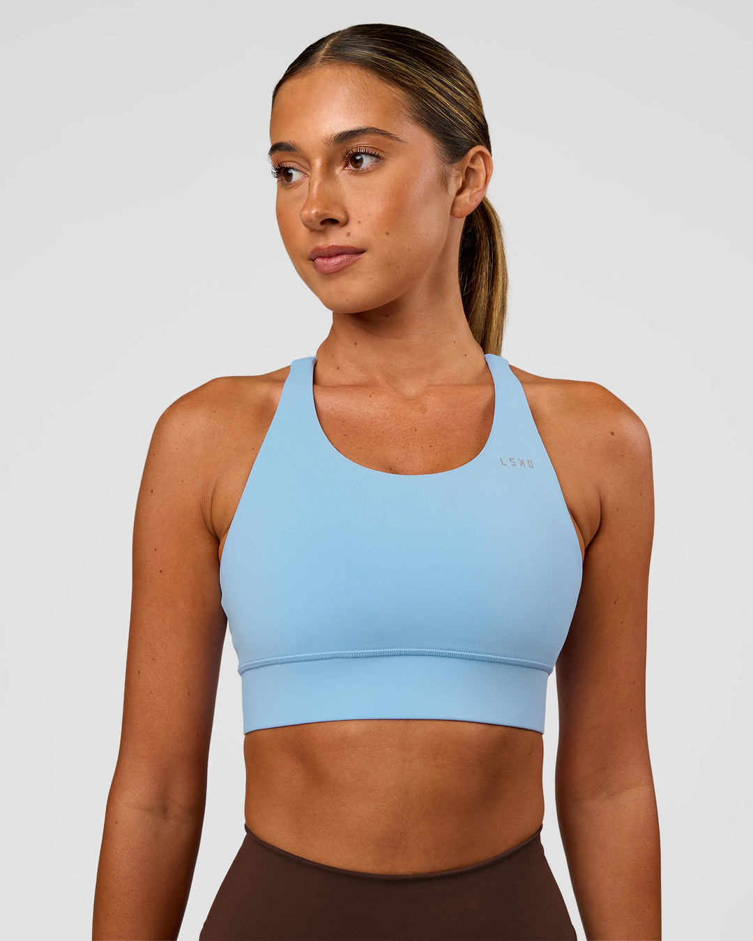 Woman wearing Accelerate Sports Bra - Open Air | Set:true | Angle:front | Model:Charli | Size:XS - view 3