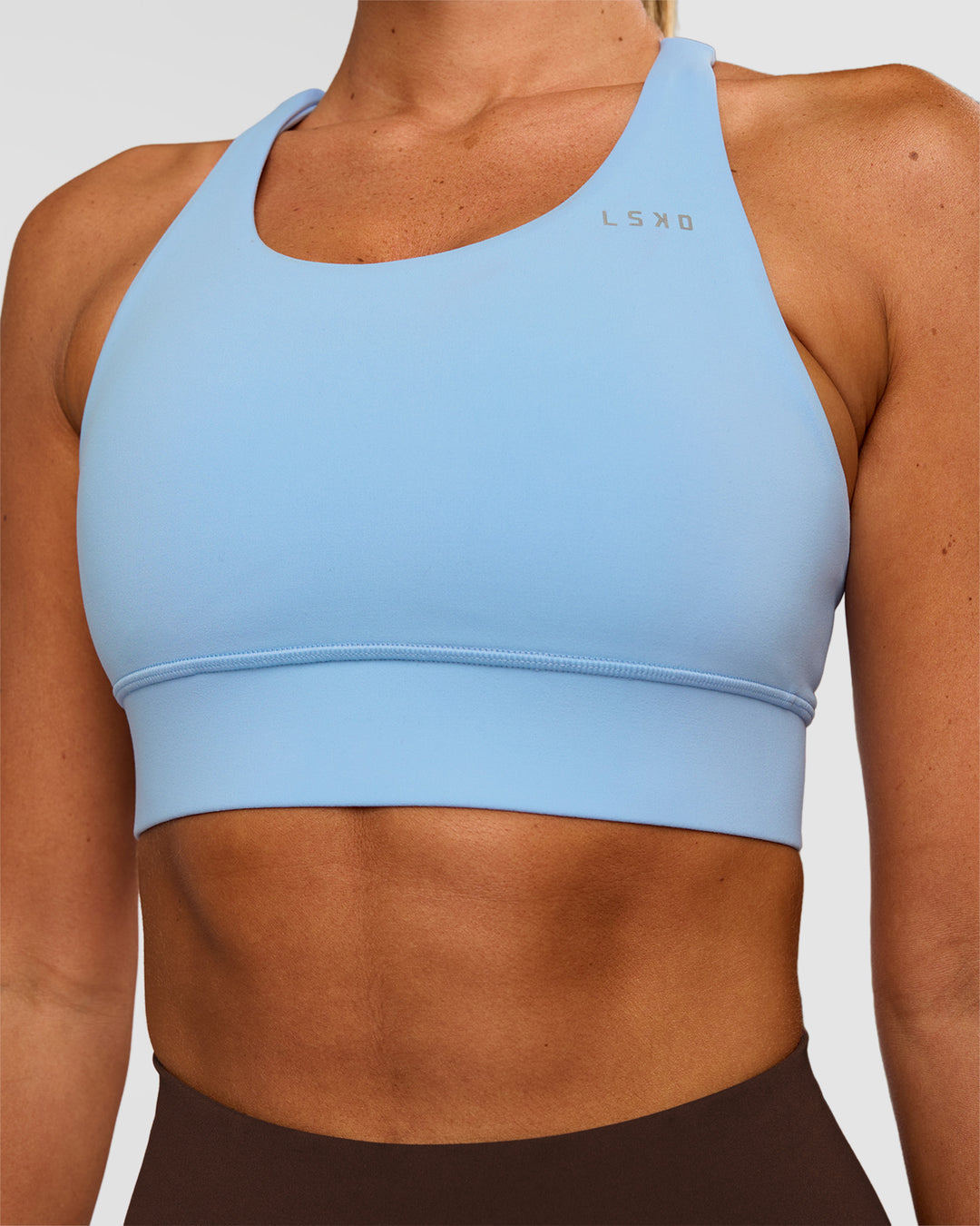 Woman wearing Accelerate Sports Bra - Open Air | Set:true | Angle:closeup | Model:Charli | Size:XS - view 5