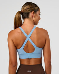 Woman wearing Accelerate Sports Bra - Open Air | Set:true | Angle:back | Model:Charli | Size:XS | Thumbnail Index: 1