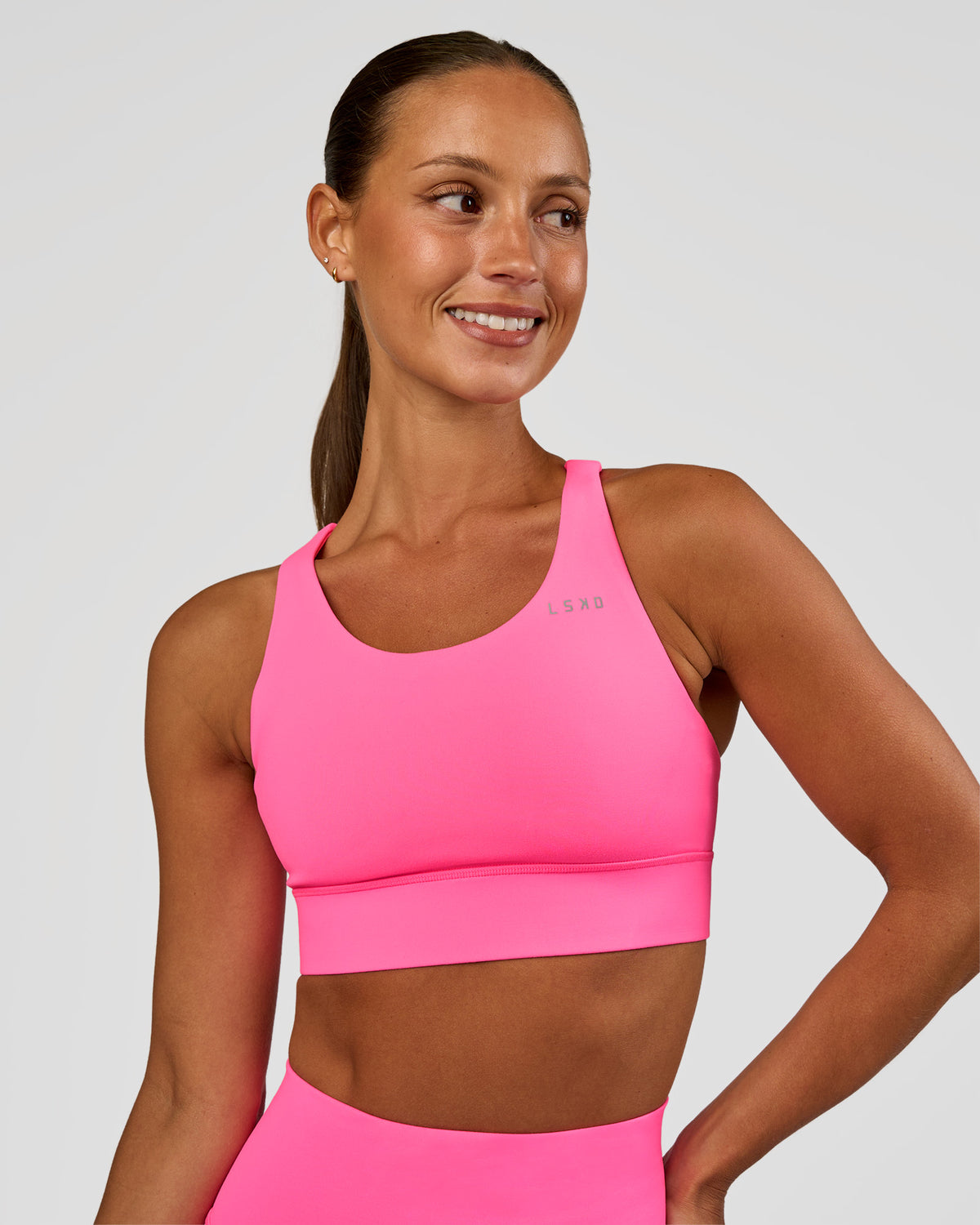 Woman wearing Accelerate Sports Bra - Sugar Plum | Set:true | Angle:front | Model:Brylee | Size:XS