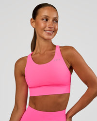 Woman wearing Accelerate Sports Bra - Sugar Plum | Set:true | Angle:front | Model:Brylee | Size:XS | Thumbnail Index: 1