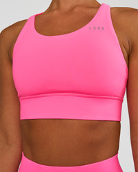 Woman wearing Accelerate Sports Bra - Sugar Plum | Set:true | Angle:closeup | Model:Brylee | Size:XS | Thumbnail Index: 0
