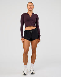 Woman wearing AeroFLX+ Long Sleeve Skimmer Half Zip - Midnight Plum/Midnight Plum | Model:Maja | Size:XS | Thumbnail Index: 5