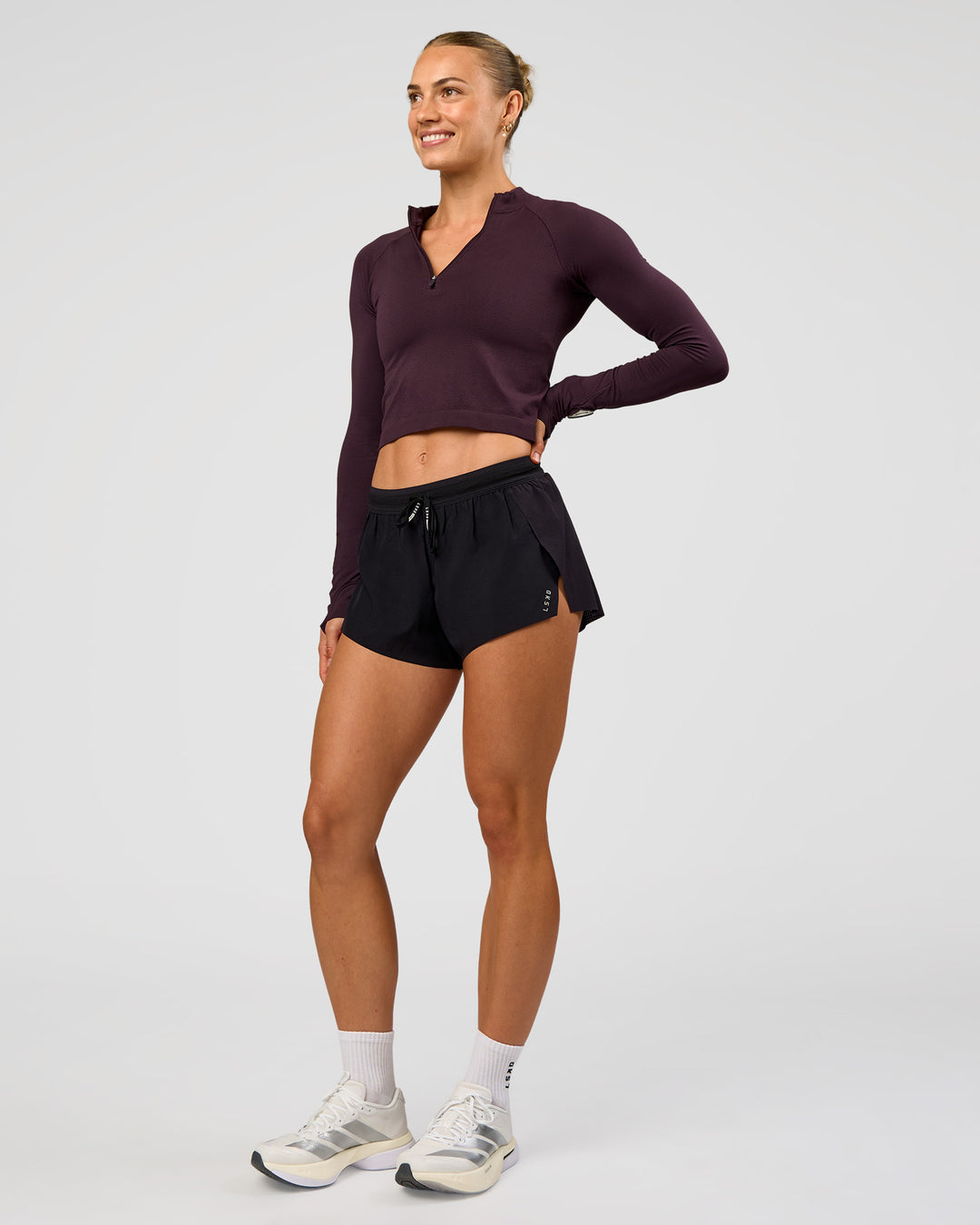 Woman wearing AeroFLX+ Long Sleeve Skimmer Half Zip - Midnight Plum/Midnight Plum | Model:Maja | Size:XS - view 3