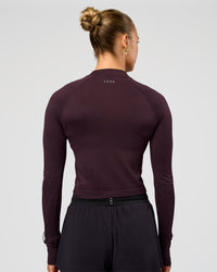 Woman wearing AeroFLX+ Long Sleeve Skimmer Half Zip - Midnight Plum/Midnight Plum | Model:Maja | Size:XS | Thumbnail Index: 3