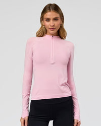 Woman wearing AeroFLX+ Long Sleeve Half Zip - Marshmallow/Marshmallow | Model:Leilani | Size:XS | Thumbnail Index: 0