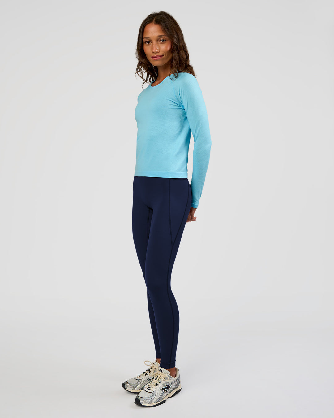 Woman wearing AeroFLX+ Seamless Long Sleeve Tee - Baltic Sea/Baltic Sea | Model:Dakota | Size:XS - view 6