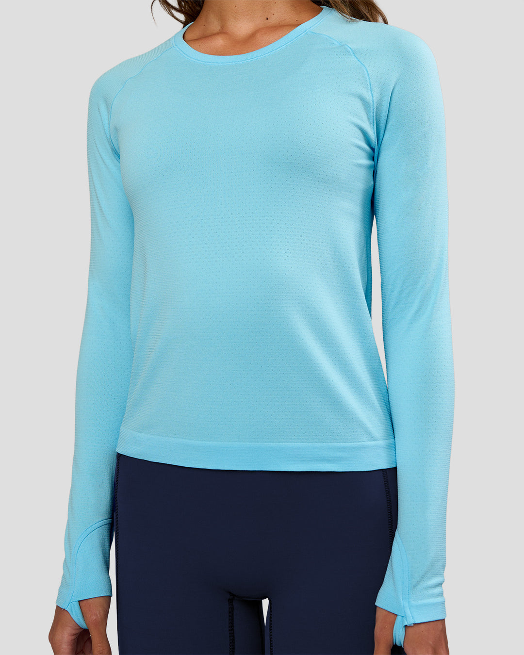 Woman wearing AeroFLX+ Seamless Long Sleeve Tee - Baltic Sea/Baltic Sea | Model:Dakota | Size:XS - view 5