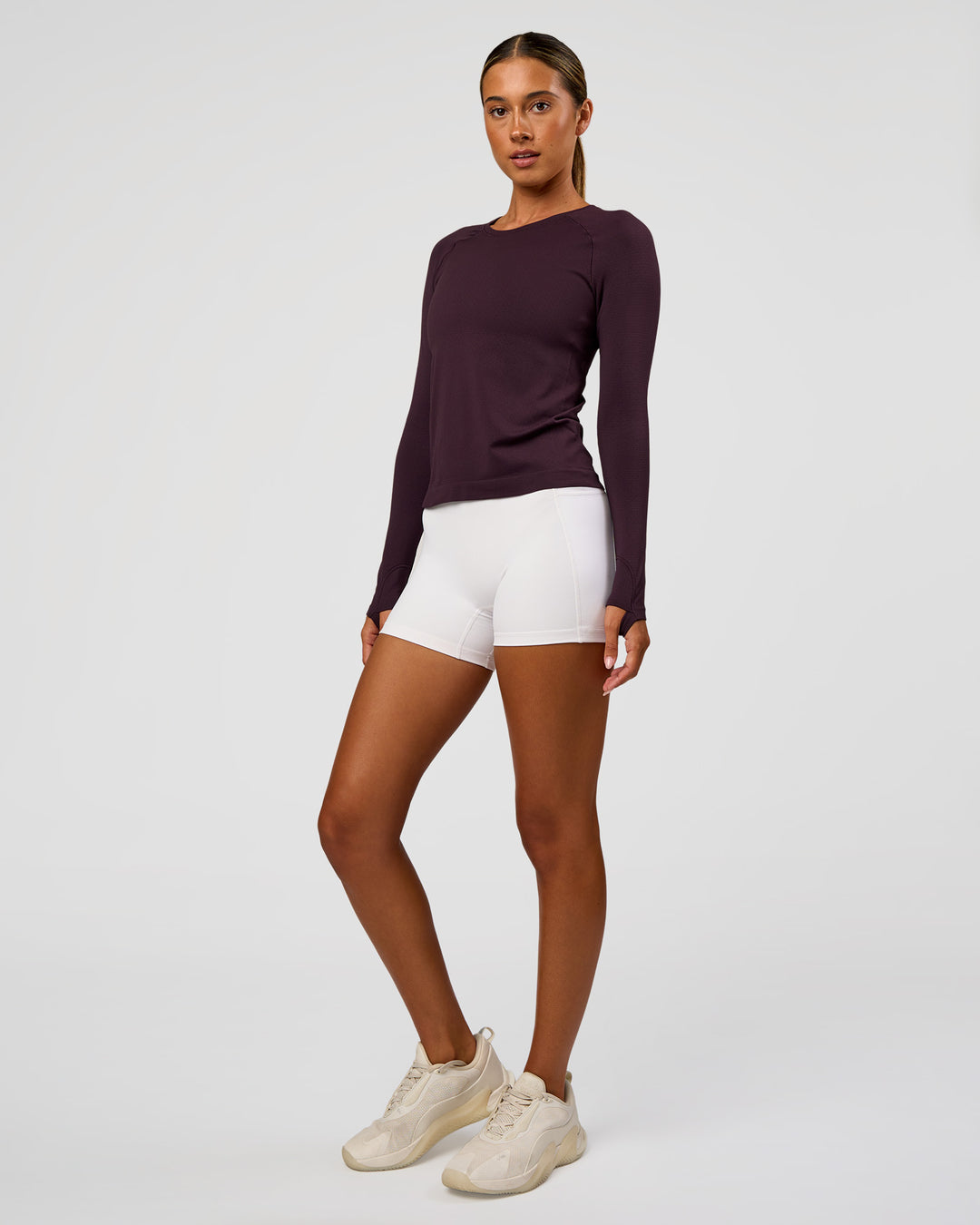 Woman wearing AeroFLX+ Seamless Long Sleeve Tee - Midnight Plum/Midnight Plum | Model:Charli | Size:XS - view 4