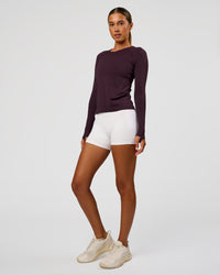 Woman wearing AeroFLX+ Seamless Long Sleeve Tee - Midnight Plum/Midnight Plum | Model:Charli | Size:XS | Thumbnail Index: 3