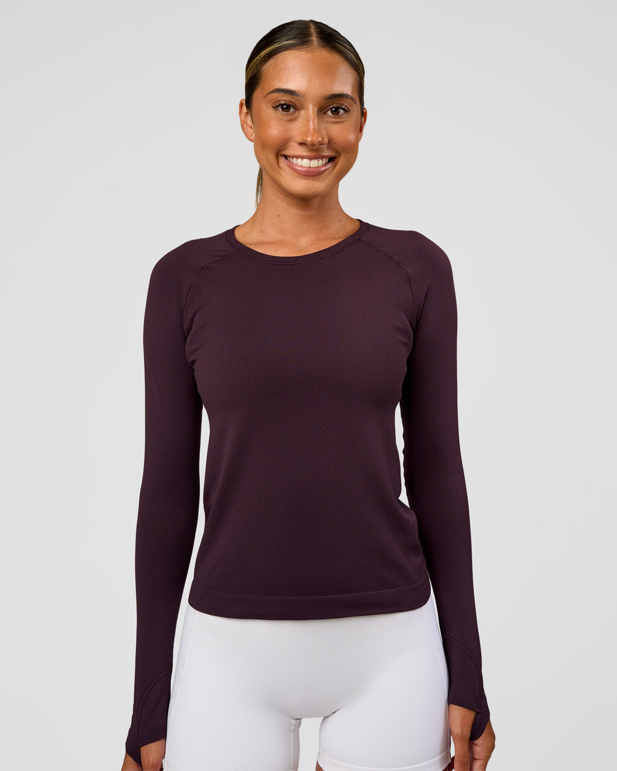 Woman wearing AeroFLX+ Seamless Long Sleeve Tee - Midnight Plum/Midnight Plum | Model:Charli | Size:XS