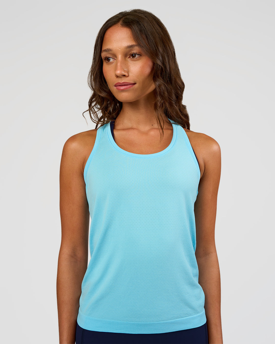 Woman wearing AeroFLX+ Seamless Tank - Baltic Sea/Baltic Sea | Model:Dakota | Size:XS - view 5