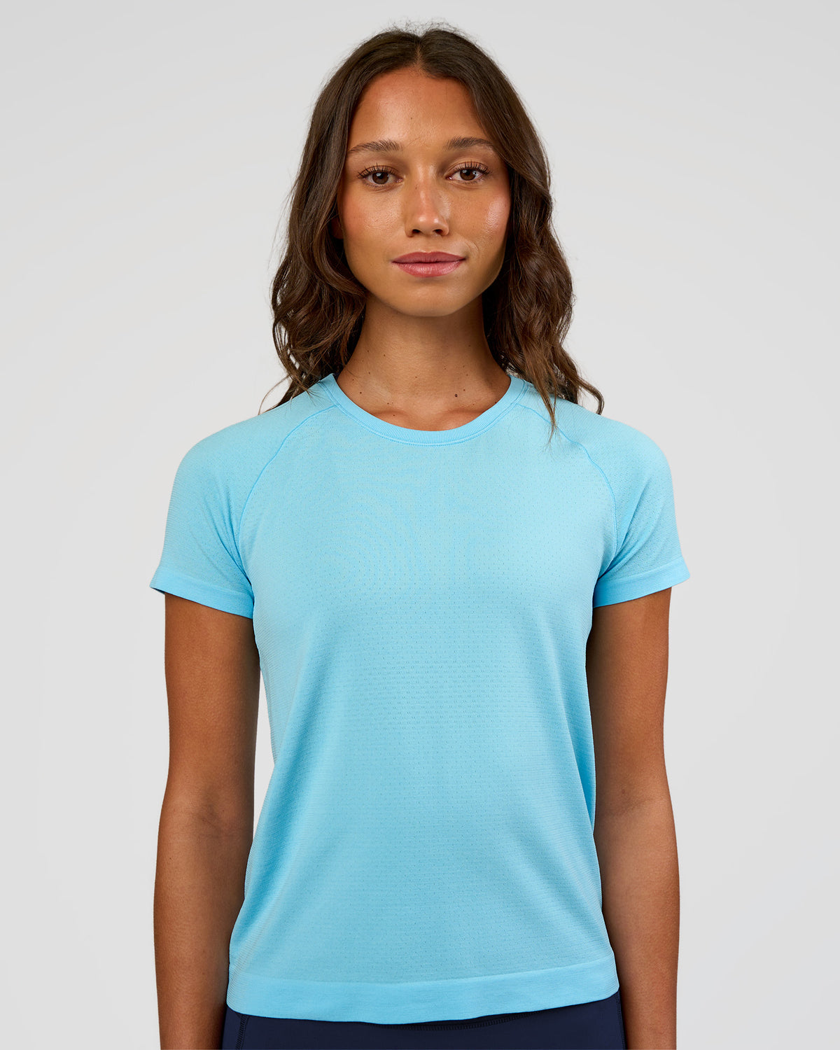 Woman wearing AeroFLX+ Seamless Tee - Baltic Sea/Baltic Sea | Model:Dakota | Size:XS