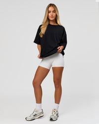 Woman wearing AfterDark ZeroCrease Boxy Tee in Black | Model:Issy | Size:XS | Thumbnail Index: 10