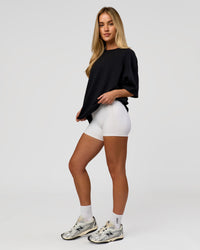 Woman wearing AfterDark ZeroCrease Boxy Tee in Black | Model:Issy | Size:XS | Thumbnail Index: 12