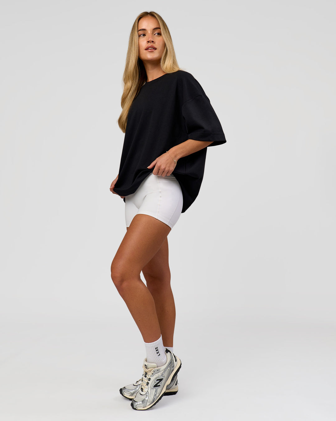 Woman wearing AfterDark ZeroCrease Boxy Tee in Black | Model:Issy | Size:XS - view 14