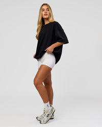 Woman wearing AfterDark ZeroCrease Boxy Tee in Black | Model:Issy | Size:XS | Thumbnail Index: 13