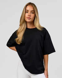 Woman wearing AfterDark ZeroCrease Boxy Tee in Black | Model:Issy | Size:XS | Thumbnail Index: 14