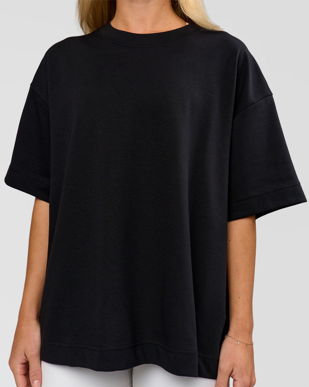 Woman wearing AfterDark ZeroCrease Boxy Tee in Black | Model:Issy | Size:XS - view 16