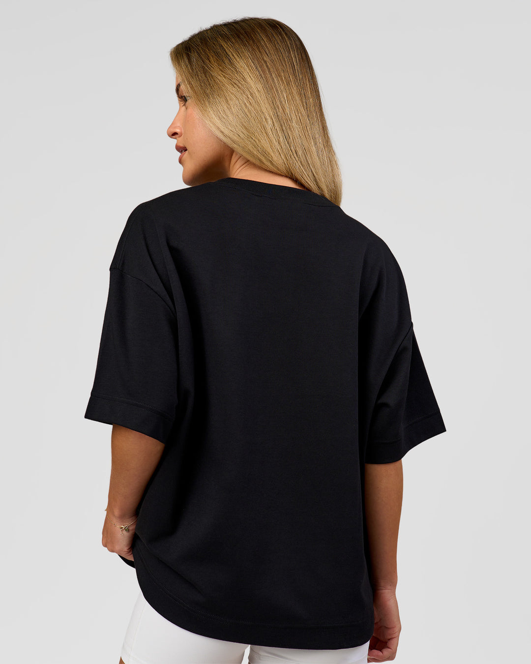 Woman wearing AfterDark ZeroCrease Boxy Tee in Black | Model:Issy | Size:XS - view 17