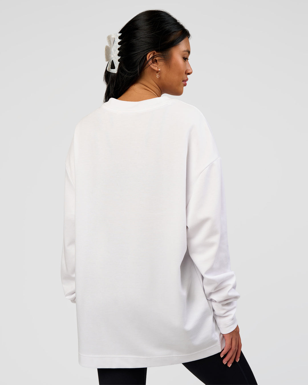 Woman wearing AfterDark ZeroCrease Long Sleeve Tee - White | Model:Loren | Size:XS - view 8
