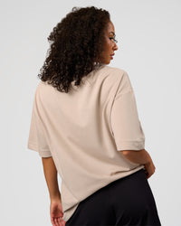 Woman wearing AfterDark ZeroCrease Oversized Tee - Shale Beige | Model:Jasmine | Size:XS | Thumbnail Index: 7