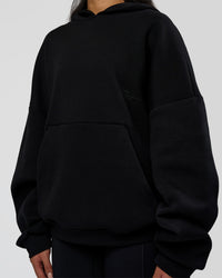 Woman wearing AfterDark ZeroCrease Oversized Hoodie - Black | Model:Loren | Size:XS | Thumbnail Index: 12
