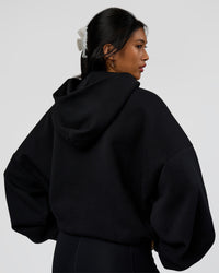 Woman wearing AfterDark ZeroCrease Oversized Hoodie - Black | Model:Loren | Size:XS | Thumbnail Index: 7