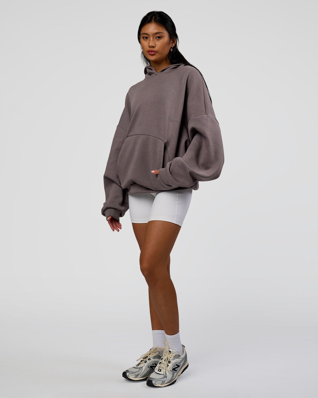 Woman wearing AfterDark ZeroCrease Oversized Hoodie - Duskstone | Model:Loren | Size:XS - view 12