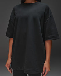 Woman wearing AfterDark ZeroCrease Oversized Tee - Black | Model:Ruby | Size:XS | Thumbnail Index: 15