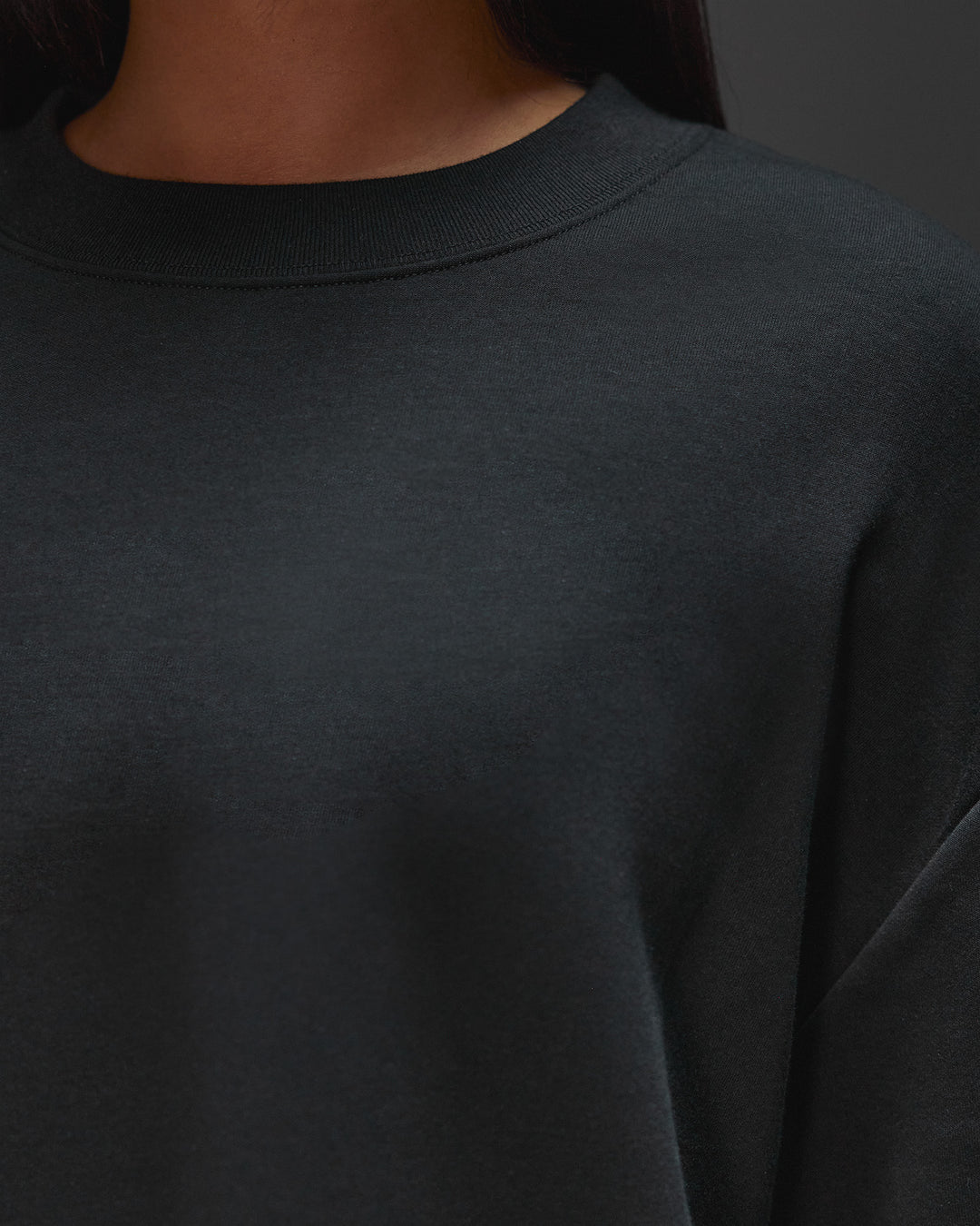 Woman wearing AfterDark ZeroCrease Oversized Tee - Black | Model:Ruby | Size:XS - view 14