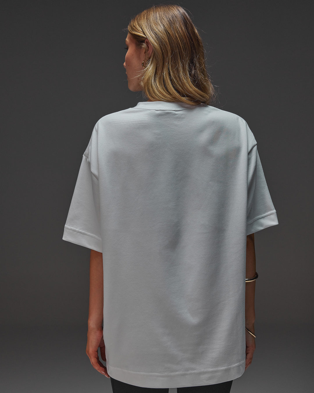 Woman wearing AfterDark ZeroCrease Oversized Tee - White | Model:Leilani | Size:XS - view 13