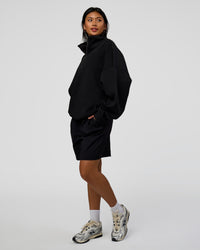 Woman wearing AfterDark ZeroCrease Quarter Zip - Black | Model:Loren | Size:XS | Thumbnail Index: 4