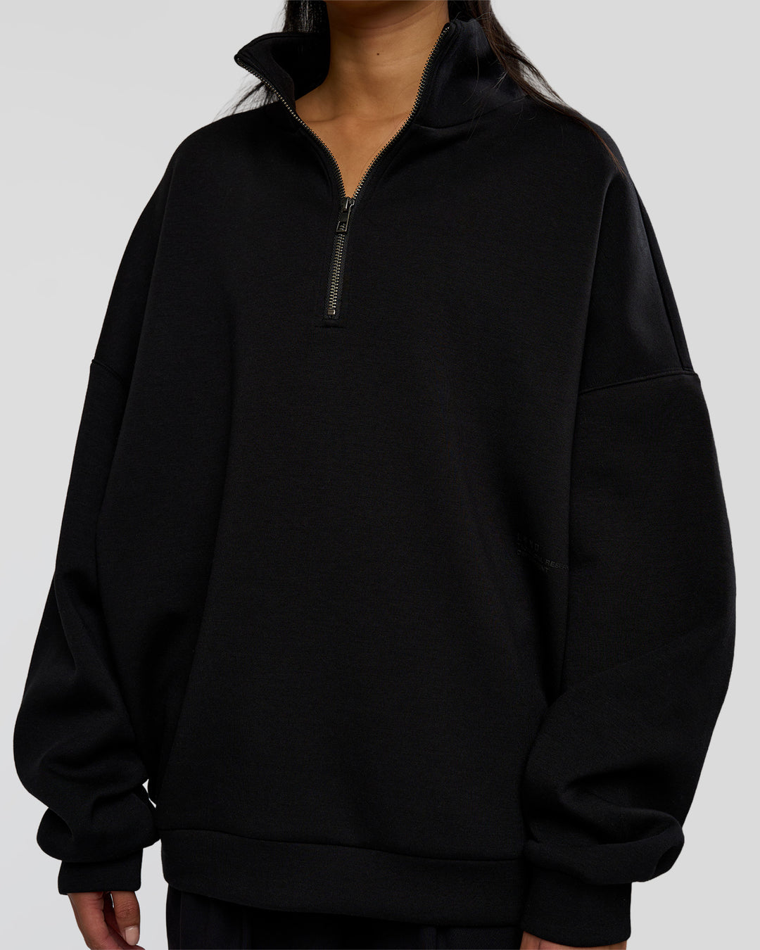 Woman wearing AfterDark ZeroCrease Quarter Zip - Black | Model:Loren | Size:XS - view 4