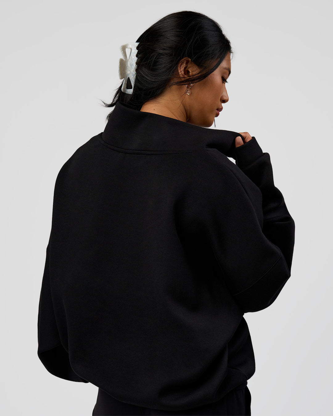Woman wearing AfterDark ZeroCrease Quarter Zip - Black | Model:Loren | Size:XS - view 8