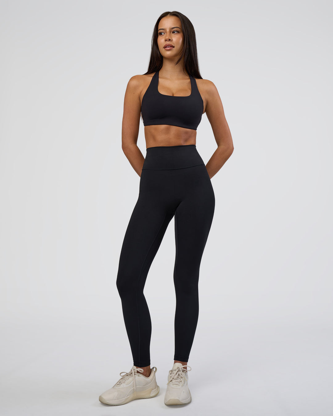 Woman wearing Aspire Sports Bra - Black | Model:Eliza | Size:XS - view 4