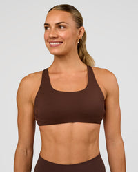 Woman wearing Aspire Sports Bra - Hot Chocolate | Model:Maja | Size:XS | Thumbnail Index: 1