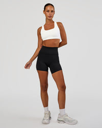 Woman wearing Aspire Sports Bra - White | Model:Brylee | Size:XS | Thumbnail Index: 2